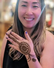 Young girl posing with henna on a party