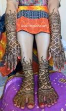 Beautiful traditional bride henna on hands and feet by Nisha Henna Arts Austin