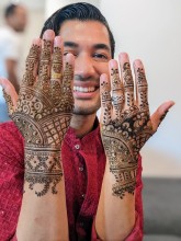A groom got matching henna with bride
