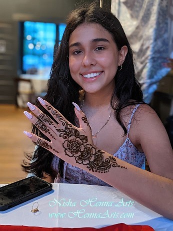 Student with henna on a project graduation celebration in Austin